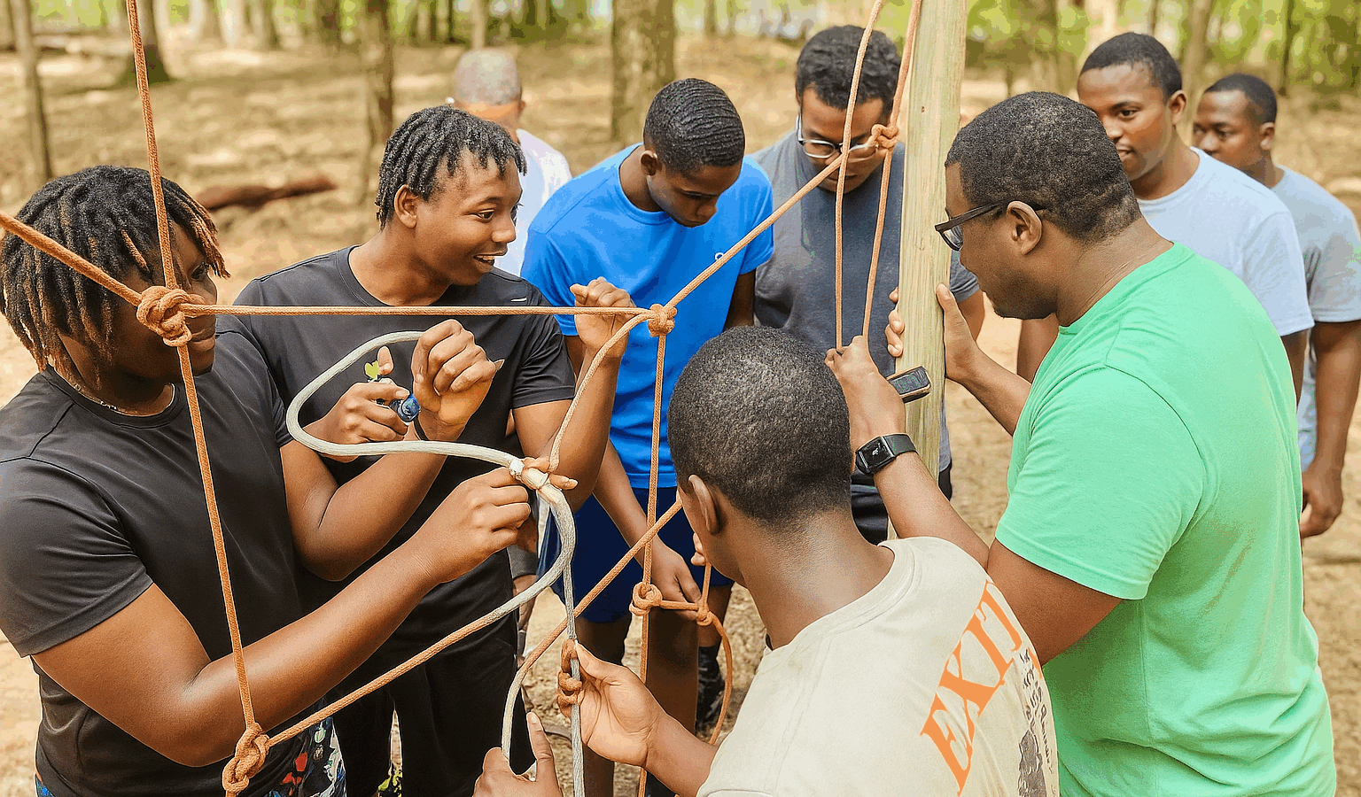“Group Of Young Adults Participating In An Outdoor Team-Building Activity At Butter And Egg Adventures In Troy, Alabama.”