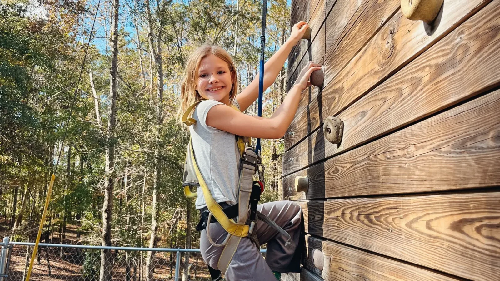 Student Climbing An Outdoor Rock Wall During A Weekend Adventure Trip At Butter And Egg Adventures In Troy, Alabama