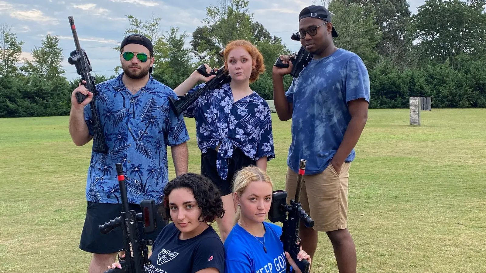 Group Players Posing With Laser Tag Gear On The Outdoor Battlefield At Butter And Egg Adventures In Alabama.